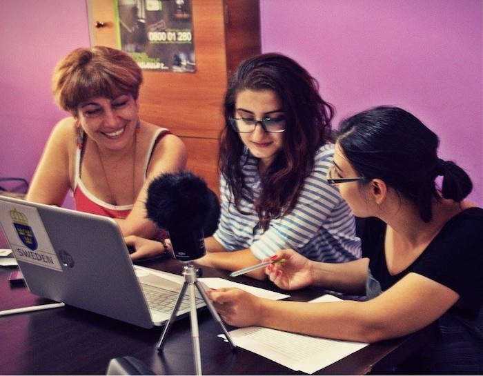 Lara (center) at work for Women’s Voice Radio | Photo by: Petra Hultman